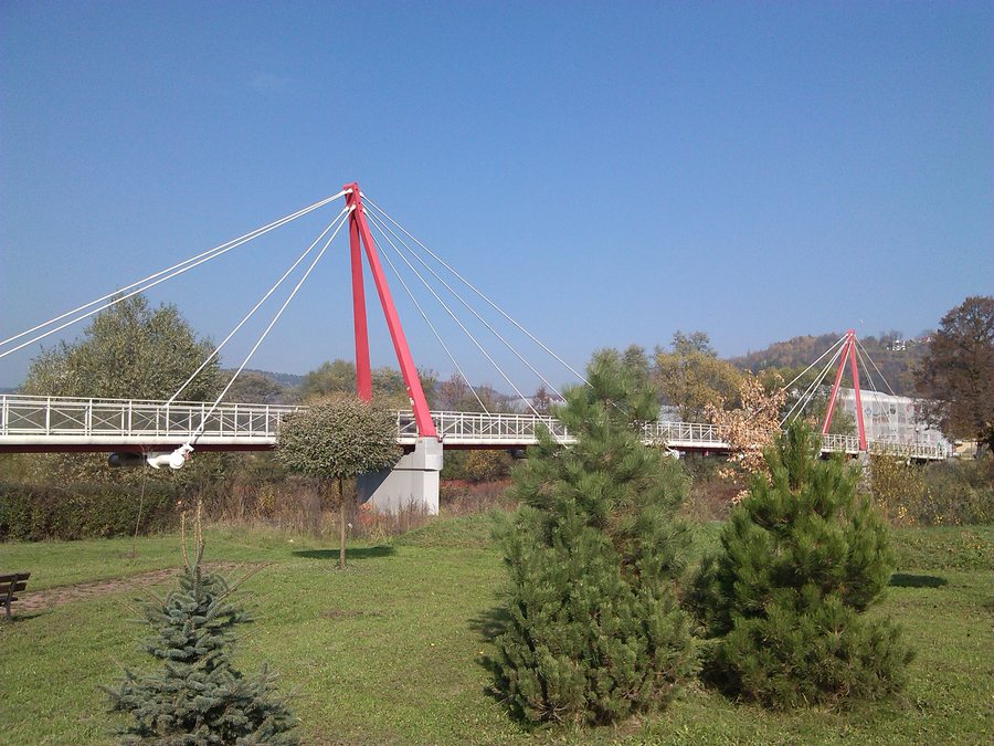 Pedestrian bridge over Raba river in Pcim