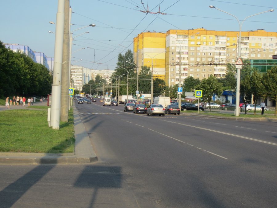 City street with traffic and apartment buildings in Minsk